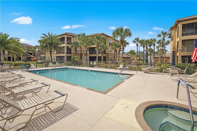 3724 Agualinda Blvd Unit 201, Cape Coral, FL 33914 - community pool featuring a community hot tub, a patio, and a residential view