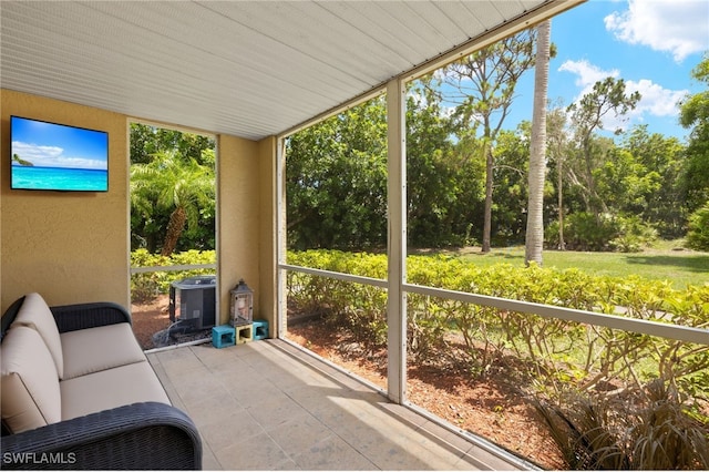 3140 Seasons Way Unit 510, Estero, FL 33928 - unfurnished sunroom with view of scattered trees