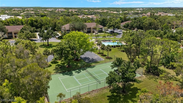 3140 Seasons Way Unit 510, Estero, FL 33928 - bird's eye view of a pool area and a tree filled landscape
