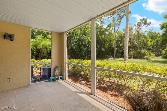 3140 Seasons Way Unit 510, Estero, FL 33928 - unfurnished sunroom with view of scattered trees