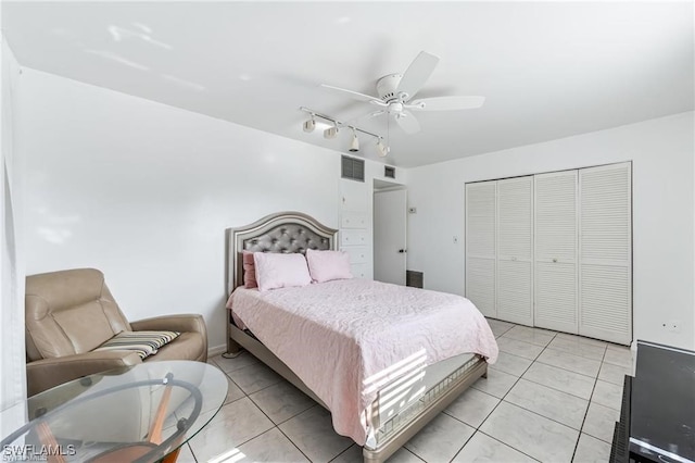 2200 50th St SW, Naples, FL 34116 - bedroom with light tile patterned floors, track lighting, a closet, and a ceiling fan