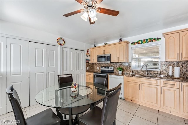 2200 50th St SW, Naples, FL 34116 - dining room featuring a ceiling fan and light tile patterned flooring