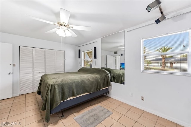 2200 50th St SW, Naples, FL 34116 - bedroom featuring light tile patterned floors, ceiling fan, and a closet