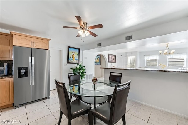 2200 50th St SW, Naples, FL 34116 - dining space with ceiling fan, a chandelier, and light tile patterned floors