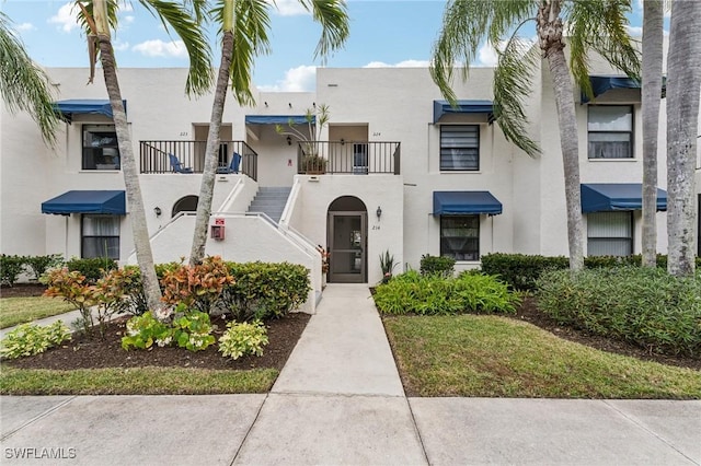 3313 Europa Dr Unit 214, Naples, FL 34105 - view of front of home with stucco siding