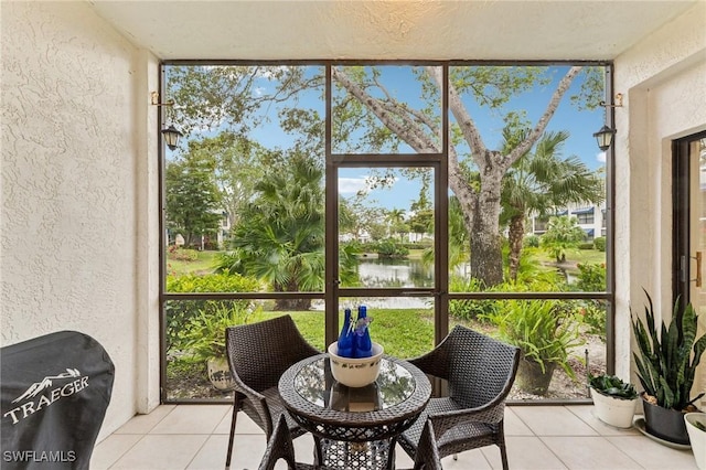 3313 Europa Dr Unit 214, Naples, FL 34105 - sunroom with a water view