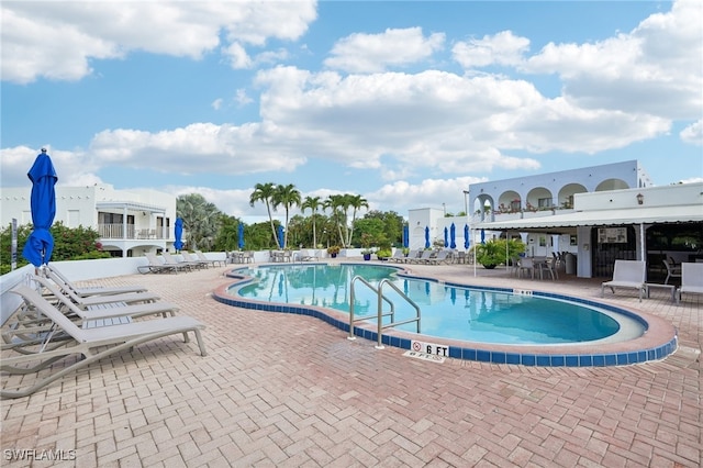 3313 Europa Dr Unit 214, Naples, FL 34105 - community pool with a patio area