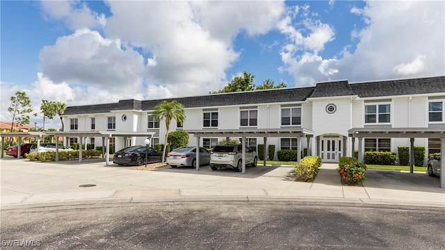 6884 Sandtrap Dr Unit 4, Fort Myers, FL 33919 - view of building exterior with covered parking