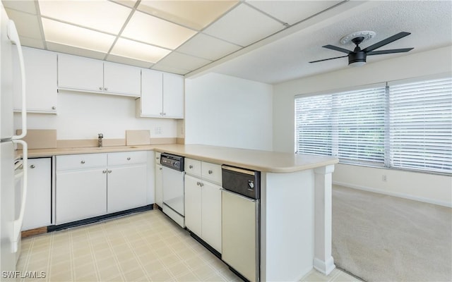 6884 Sandtrap Dr Unit 4, Fort Myers, FL 33919 - kitchen with white appliances, a peninsula, light countertops, ceiling fan, and white cabinets
