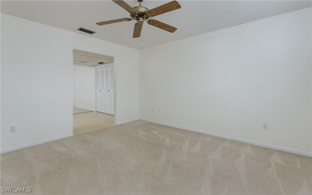 6884 Sandtrap Dr Unit 4, Fort Myers, FL 33919 - spare room featuring light carpet and ceiling fan