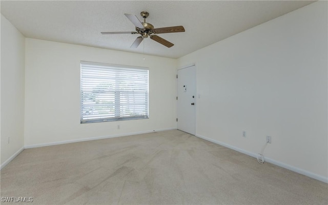 6884 Sandtrap Dr Unit 4, Fort Myers, FL 33919 - empty room with light colored carpet and ceiling fan