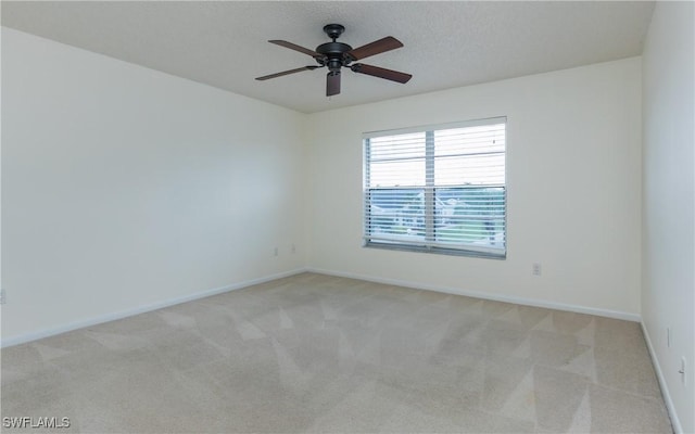 6884 Sandtrap Dr Unit 4, Fort Myers, FL 33919 - unfurnished room with light carpet and a ceiling fan