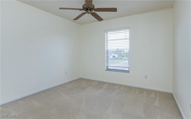 6884 Sandtrap Dr Unit 4, Fort Myers, FL 33919 - spare room with light colored carpet and ceiling fan