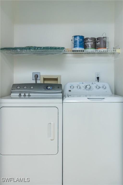 6884 Sandtrap Dr Unit 4, Fort Myers, FL 33919 - laundry area with washer and dryer