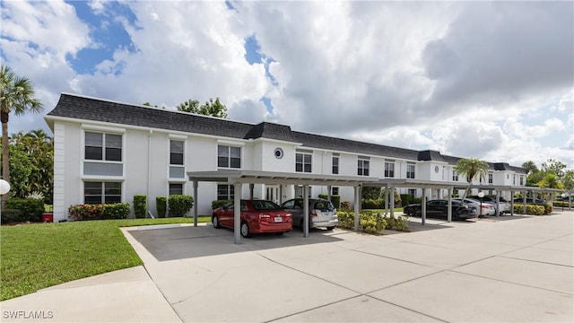 6884 Sandtrap Dr Unit 4, Fort Myers, FL 33919 - view of building exterior with covered parking