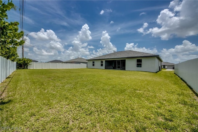 506 NE 2nd Place, Cape Coral, FL 33909 - rear view of property featuring a fenced backyard and stucco siding