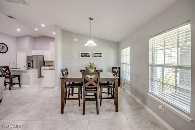 506 NE 2nd Place, Cape Coral, FL 33909 - dining room featuring lofted ceiling, light tile patterned floors, and recessed lighting