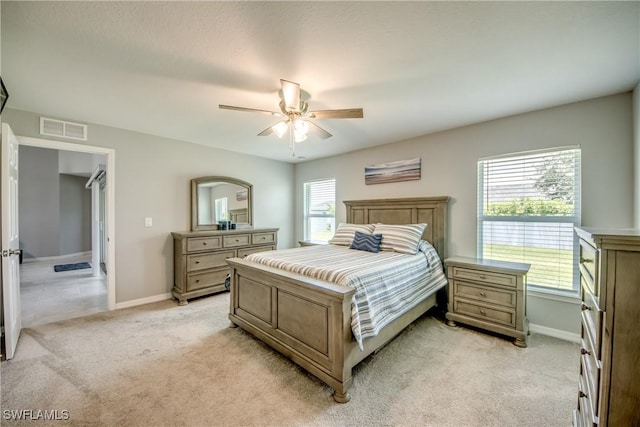 506 NE 2nd Place, Cape Coral, FL 33909 - bedroom featuring light carpet and a ceiling fan