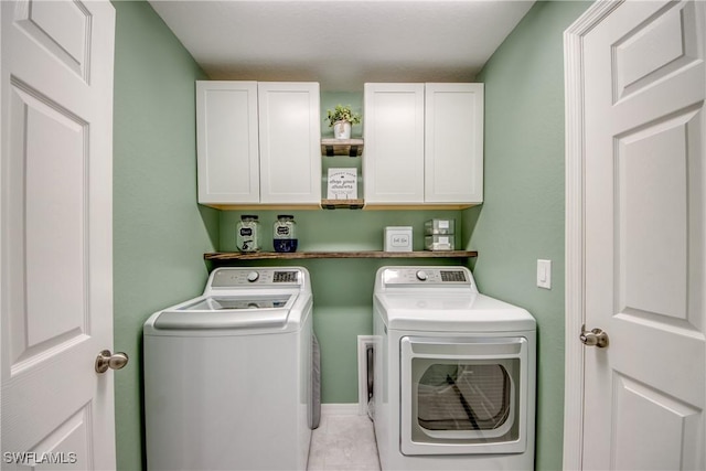 506 NE 2nd Place, Cape Coral, FL 33909 - laundry room with washing machine and clothes dryer and cabinet space