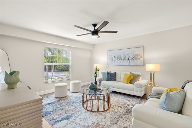 211 11th St NW, Naples, FL 34120 - living room featuring a ceiling fan and wood finished floors