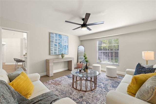 211 11th St NW, Naples, FL 34120 - living room featuring wood finished floors and ceiling fan