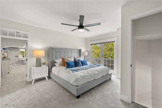 211 11th St NW, Naples, FL 34120 - carpeted bedroom with access to exterior, multiple windows, a wall unit AC, and ceiling fan