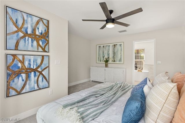 211 11th St NW, Naples, FL 34120 - bedroom with carpet, ceiling fan, and ensuite bathroom