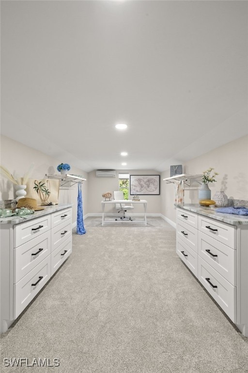 211 11th St NW, Naples, FL 34120 - interior space with a wall mounted AC and light carpet