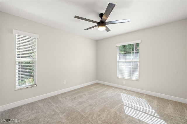 211 11th St NW, Naples, FL 34120 - spare room featuring light carpet and ceiling fan