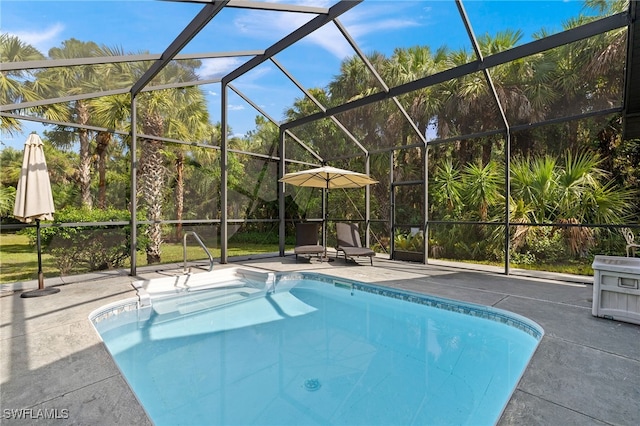 211 11th St NW, Naples, FL 34120 - swimming pool featuring glass enclosure and a patio