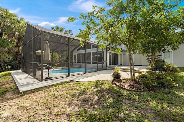 211 11th St NW, Naples, FL 34120 - swimming pool featuring a patio and glass enclosure