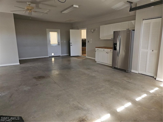 211 11th St NW, Naples, FL 34120 - garage with stainless steel refrigerator with ice dispenser, washer / clothes dryer, and a ceiling fan