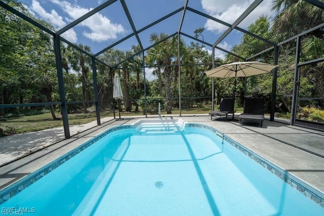 211 11th St NW, Naples, FL 34120 - outdoor pool featuring glass enclosure and a patio