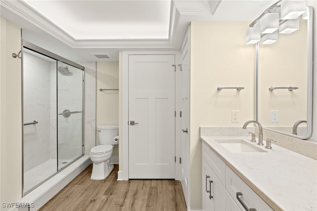 3067 W Gulf Dr Unit 102, Sanibel, FL 33957 - bathroom with wood finished floors, vanity, a shower stall, and crown molding