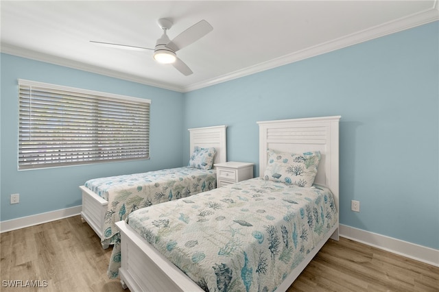 3067 W Gulf Dr Unit 102, Sanibel, FL 33957 - bedroom with ornamental molding, wood finished floors, and a ceiling fan