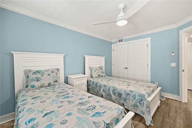 3067 W Gulf Dr Unit 102, Sanibel, FL 33957 - bedroom featuring ornamental molding, wood finished floors, a closet, and ceiling fan