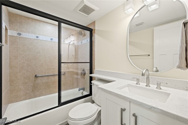 3067 W Gulf Dr Unit 102, Sanibel, FL 33957 - bathroom with vanity and combined bath / shower with glass door