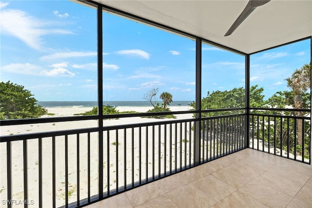 3067 W Gulf Dr Unit 102, Sanibel, FL 33957 - unfurnished sunroom featuring view of water and beach and healthy amount of natural light
