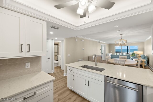 3067 W Gulf Dr Unit 102, Sanibel, FL 33957 - kitchen with dishwasher, crown molding, open floor plan, white cabinets, and a ceiling fan