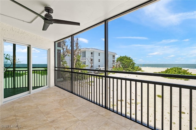 3067 W Gulf Dr Unit 102, Sanibel, FL 33957 - unfurnished sunroom with a water view