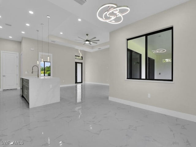 410 Plumosa Ave, Lehigh Acres, FL 33972 - unfurnished living room featuring a chandelier, light marble finish floors, recessed lighting, and a ceiling fan