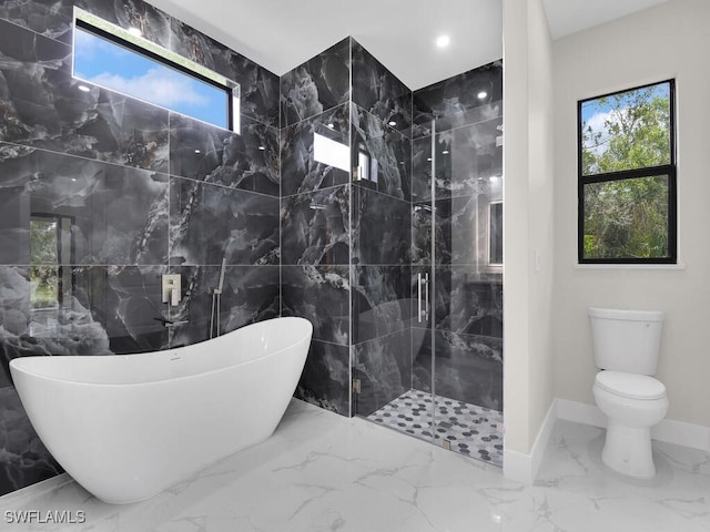 410 Plumosa Ave, Lehigh Acres, FL 33972 - bathroom featuring marble tiled floors, a freestanding bath, a marble finish shower, and tile walls
