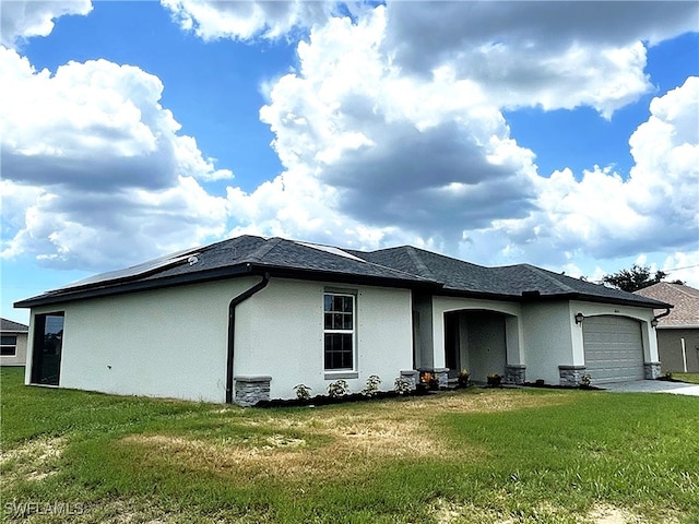 2614 NE 6th Pl, Cape Coral, FL 33909 - view of side of property with stucco siding, a garage, a lawn, and driveway