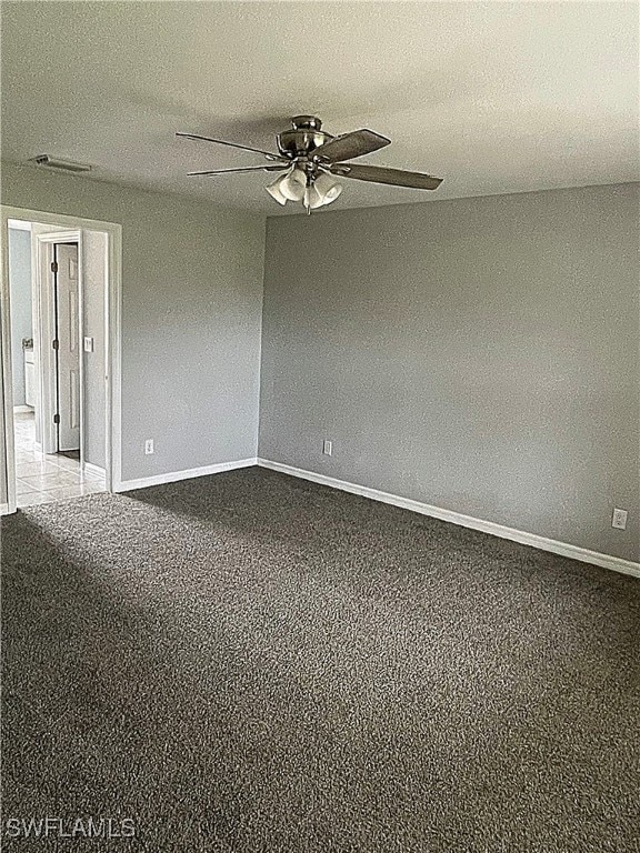2614 NE 6th Pl, Cape Coral, FL 33909 - carpeted empty room featuring ceiling fan and baseboards