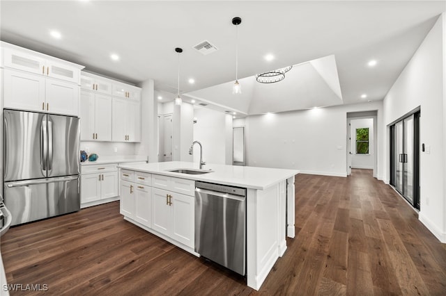 3708 Stagg Ct, Fort Myers, FL 33905 - kitchen featuring stainless steel appliances, dark wood-style flooring, light countertops, an island with sink, and recessed lighting