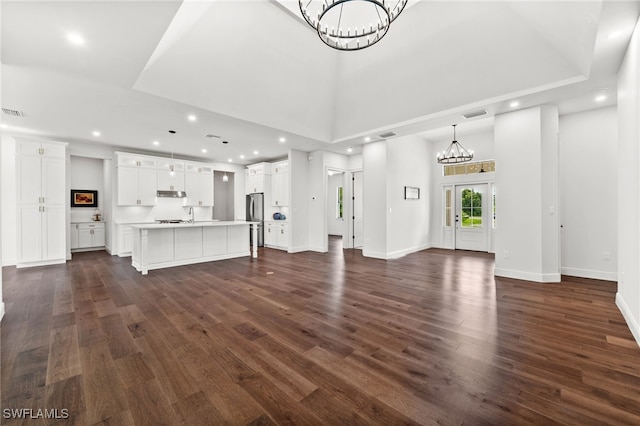 3708 Stagg Ct, Fort Myers, FL 33905 - unfurnished living room featuring a chandelier, dark wood finished floors, and recessed lighting