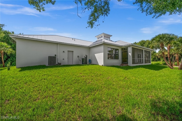 3708 Stagg Ct, Fort Myers, FL 33905 - back of house with stucco siding, a lawn, a sunroom, and a metal roof
