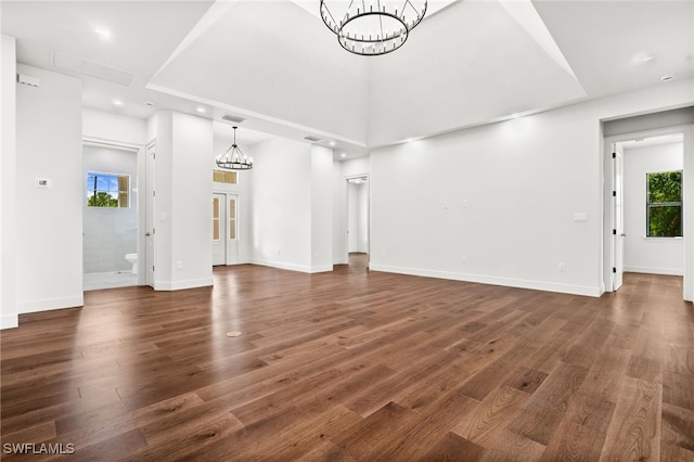 3708 Stagg Ct, Fort Myers, FL 33905 - unfurnished living room with a chandelier, dark wood-style floors, and recessed lighting