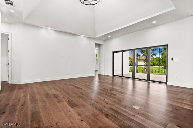 3708 Stagg Ct, Fort Myers, FL 33905 - unfurnished living room with a towering ceiling, wood finished floors, and recessed lighting