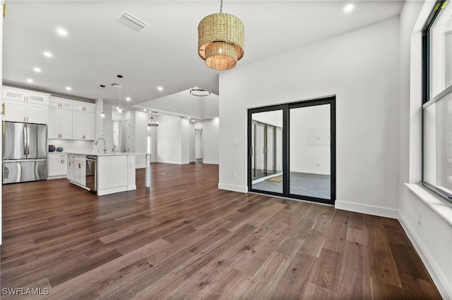 3708 Stagg Ct, Fort Myers, FL 33905 - unfurnished living room with dark wood-style flooring, recessed lighting, and a chandelier